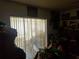 Living room with sliding glass doors and window coverings at 3310 68Th N Ave, St Petersburg, FL 33702