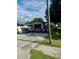 House exterior with garage and multiple vehicles parked on the property at 3310 68Th N Ave, St Petersburg, FL 33702