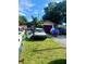 House exterior showing a cluttered front yard and several vehicles at 3310 68Th N Ave, St Petersburg, FL 33702