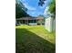 House exterior with a screened patio and storage shed in the backyard at 3310 68Th N Ave, St Petersburg, FL 33702