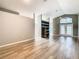Open living room with hardwood floors and high ceilings, offering a spacious feel at 7823 Floradora, New Port Richey, FL 34654