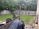 Fenced backyard with patio, grill, and picnic table at 8388 Begonia St, Spring Hill, FL 34608