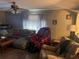Relaxing living room with comfortable seating and hardwood floors at 8388 Begonia St, Spring Hill, FL 34608