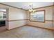 Bright dining room with chandelier and view into kitchen at 7208 Clouchester Ct, Hudson, FL 34667