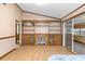 Gathering room with built-in shelving, fireplace, and sliding glass doors at 7208 Clouchester Ct, Hudson, FL 34667