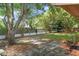 Large backyard with grassy area and trees at 7208 Clouchester Ct, Hudson, FL 34667