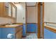 Bathroom with wood vanity, tiled floor, and shower at 7208 Clouchester Ct, Hudson, FL 34667