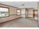 Living room with neutral walls, carpeted floors and entryway at 7208 Clouchester Ct, Hudson, FL 34667