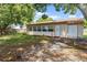 Back exterior view, showing a sunroom and shed at 7208 Clouchester Ct, Hudson, FL 34667