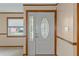 Front entry with white door and stained glass accents at 7208 Clouchester Ct, Hudson, FL 34667