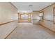 Empty dining room with neutral walls and carpeted floor at 7208 Clouchester Ct, Hudson, FL 34667