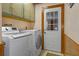 Laundry room with washer, dryer, and cabinets at 7208 Clouchester Ct, Hudson, FL 34667