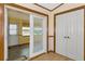Hallway with doors leading to other rooms and a sliding glass door at 7208 Clouchester Ct, Hudson, FL 34667
