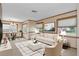Living room with off-white sofa and stylish coffee table at 7208 Clouchester Ct, Hudson, FL 34667