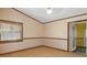 Bright bedroom featuring laminate flooring and a door to outside at 7208 Clouchester Ct, Hudson, FL 34667