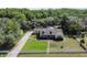 Aerial view of a single-Gathering home with a large yard and driveway at 17852 Fancy Ln, Hudson, FL 34667