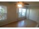 Bright bedroom with wood floors, ceiling fan, and large windows at 2370 Jamaican St # 56, Clearwater, FL 33763