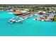 Aerial view of lagoon-style pool area with floating cabanas, restaurant and recreation area at 31941 Blue Passing Loop, Wesley Chapel, FL 33545