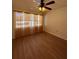 Bedroom with hardwood floors and ceiling fan at 7712 Hillside Ct # 202, Hudson, FL 34667