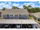 Exterior showing the building with parking at 7712 Hillside Ct # 202, Hudson, FL 34667