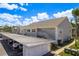 Charming condo featuring a two-story building with carport parking in a well-maintained community at 7712 Hillside Ct # 202, Hudson, FL 34667