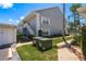 Exterior view of a two-story residential building showcasing stairs and landscaping at 7712 Hillside Ct # 202, Hudson, FL 34667