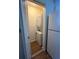 Laundry closet with stacked washer and dryer and extra storage at 7712 Hillside Ct # 202, Hudson, FL 34667