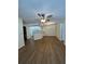 Open living space with ceiling fan and wood-look flooring throughout at 7712 Hillside Ct # 202, Hudson, FL 34667