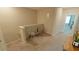 Upstairs hallway with seating area and access to bedrooms at 31941 Blue Passing Loop, Wesley Chapel, FL 33545