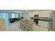 Open concept kitchen with island, living room and stairs at 31941 Blue Passing Loop, Wesley Chapel, FL 33545