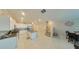 Open concept kitchen with island, dining area and stairs at 31941 Blue Passing Loop, Wesley Chapel, FL 33545