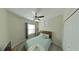 Cozy bedroom featuring a double bed and ceiling fan at 31941 Blue Passing Loop, Wesley Chapel, FL 33545