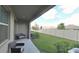 Covered patio overlooking a fenced backyard at 31941 Blue Passing Loop, Wesley Chapel, FL 33545