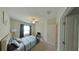 Bright bedroom with a double bed and ceiling fan at 31941 Blue Passing Loop, Wesley Chapel, FL 33545