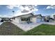 House exterior with a white garage door and landscaping at 4464 Marine Pkwy, New Port Richey, FL 34652