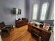 Home office with hardwood floors and built-in desk at 11033 Baywind Ct, Weeki Wachee, FL 34613