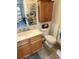 Clean bathroom with wood vanity and updated fixtures at 11033 Baywind Ct, Weeki Wachee, FL 34613