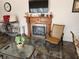 Cozy living room with fireplace and large TV at 11033 Baywind Ct, Weeki Wachee, FL 34613