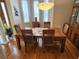 Elegant dining room showcasing a wood table and cane chairs, bathed in natural light at 11033 Baywind Ct, Weeki Wachee, FL 34613