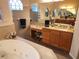 Spa-like bathroom with a large soaking tub and vanity at 11033 Baywind Ct, Weeki Wachee, FL 34613
