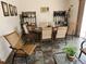 Casual dining area with wood flooring and wicker chairs at 11033 Baywind Ct, Weeki Wachee, FL 34613