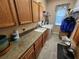 Laundry room with washer, dryer, cabinets, and countertop at 11033 Baywind Ct, Weeki Wachee, FL 34613