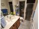 Bathroom with single vanity, shower, and toilet at 11033 Baywind Ct, Weeki Wachee, FL 34613