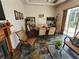 Bright dining area with wicker furniture and wood flooring at 11033 Baywind Ct, Weeki Wachee, FL 34613