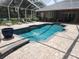 Relaxing screened pool and patio area at 11033 Baywind Ct, Weeki Wachee, FL 34613