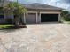 Two-car garage with paved driveway at 11033 Baywind Ct, Weeki Wachee, FL 34613