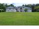 Two-story home with a large front yard at 11033 Baywind Ct, Weeki Wachee, FL 34613