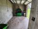 Unfinished garage interior with concrete floor and various tools at 11033 Baywind Ct, Weeki Wachee, FL 34613