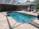 Large screened pool with plenty of space for lounging at 11033 Baywind Ct, Weeki Wachee, FL 34613