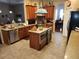 Open kitchen boasts a large island, ample cabinetry, and top-of-the-line appliances at 11033 Baywind Ct, Weeki Wachee, FL 34613